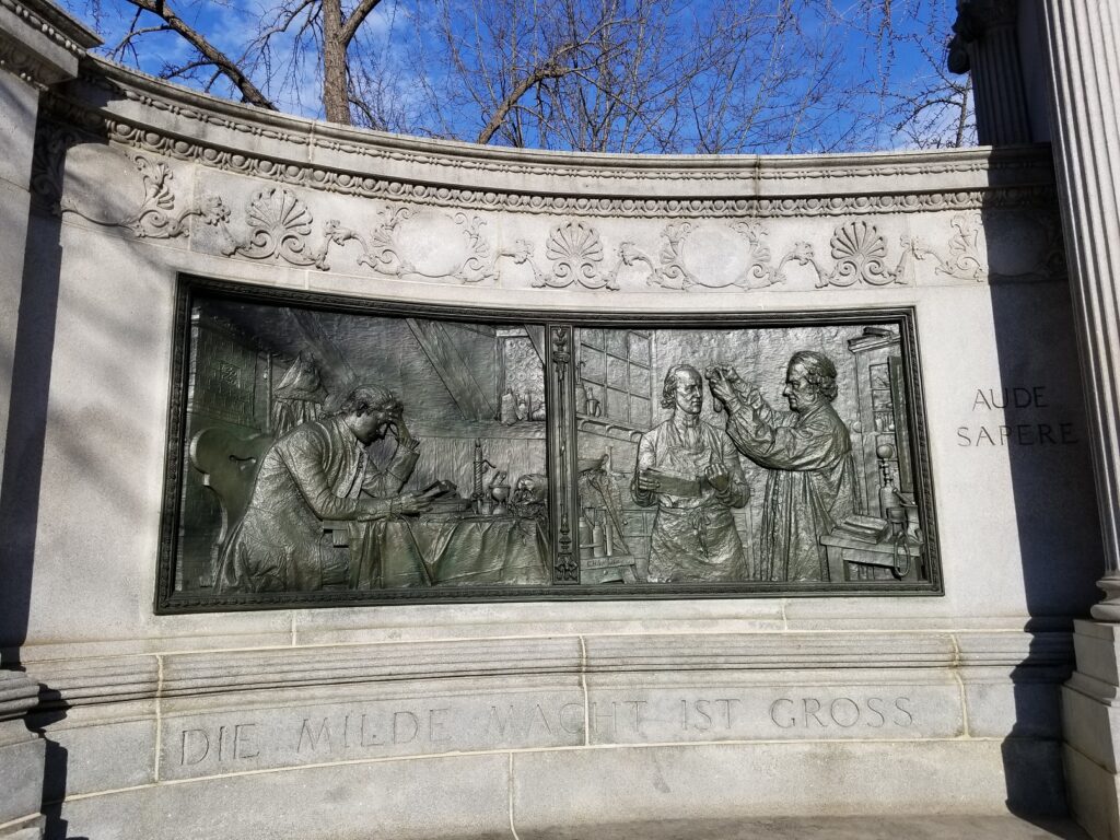 Hahnemann Memorial, left side bas-relief
Die Milde Macht Ist Gross